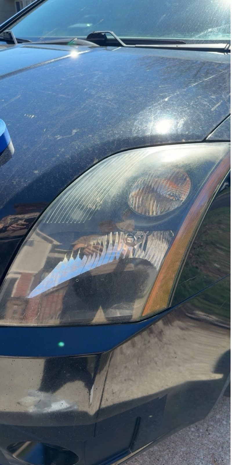 Headlight before restoration, hazed and yellowed
